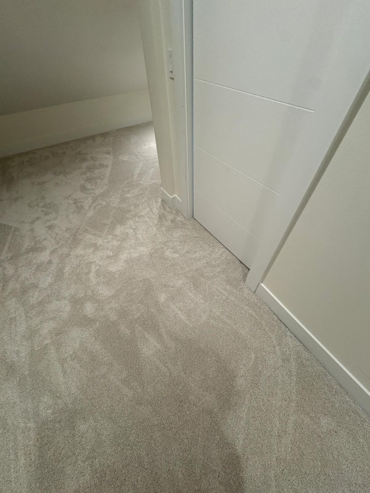 Carpet carried through the hallway and around the corners