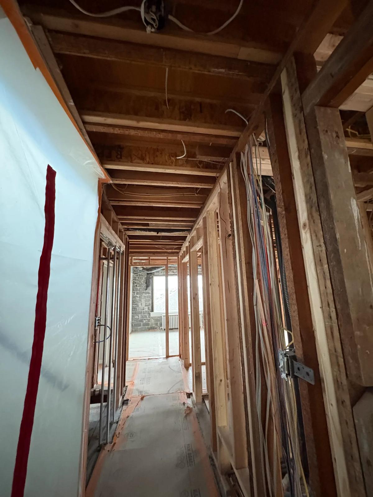 Plastic dust barrier sealing the work area from the rest of the home