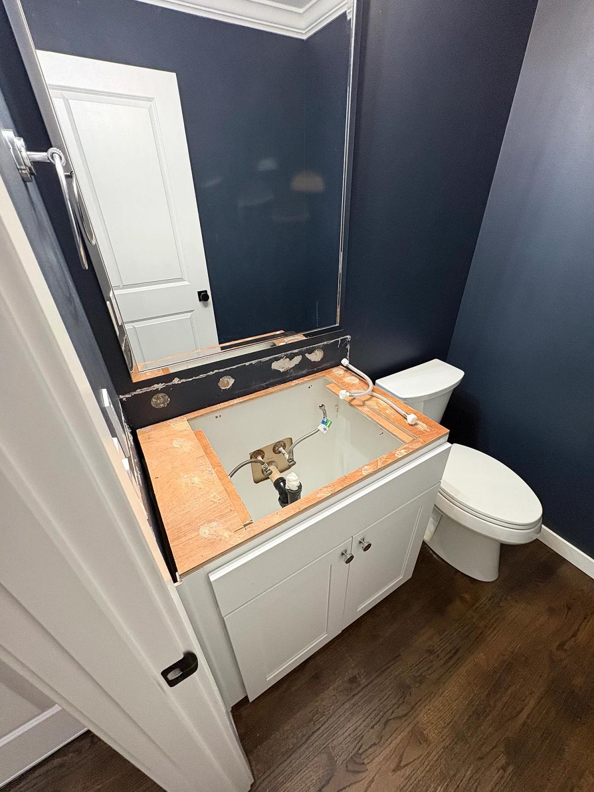 Actual photo: vanity stone top removed while the cabinet remains