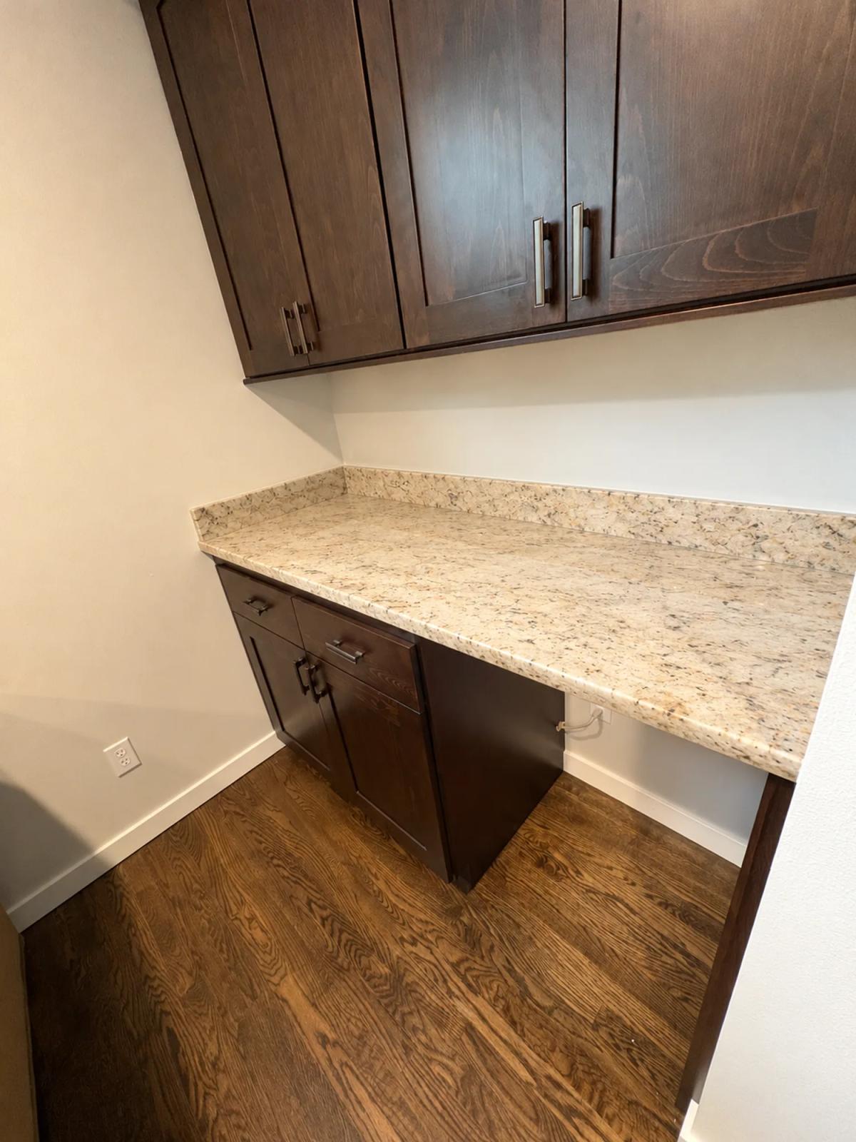 Light granite countertop before and after removal., before